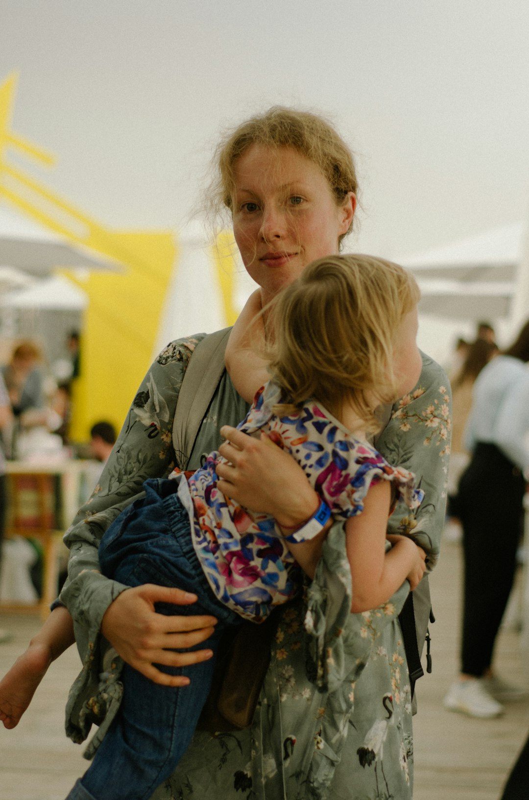 Photo by Kate Bezzubets a woman holding a little girl in her arms